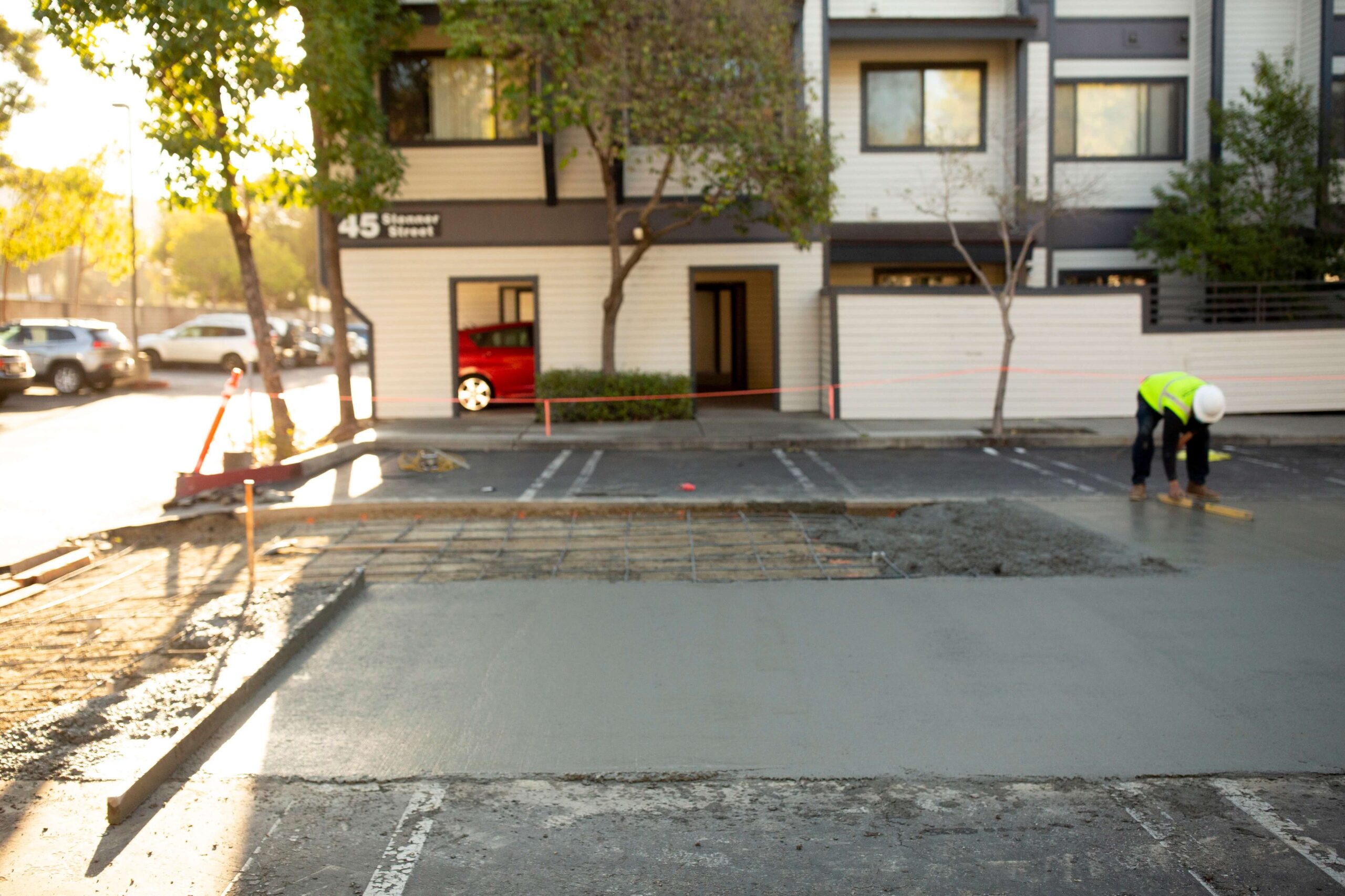 The GPM team laying fresh concrete in a parking and walking area.